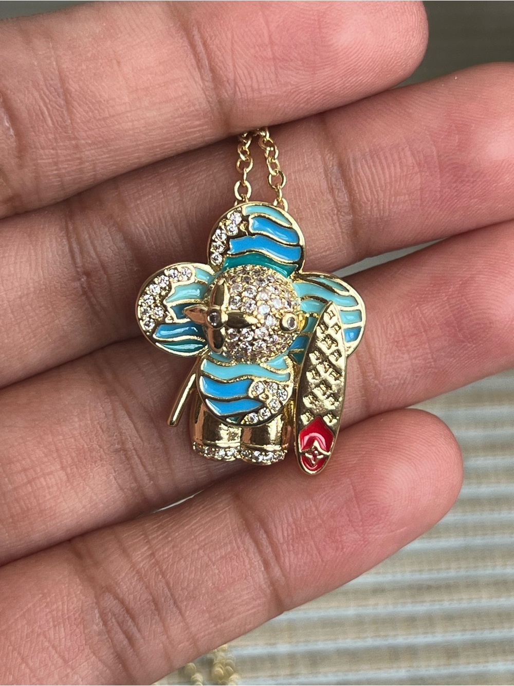 blue surfer floral gold pendant with pavé accents and detailed surfboard - Picture 4 of 5